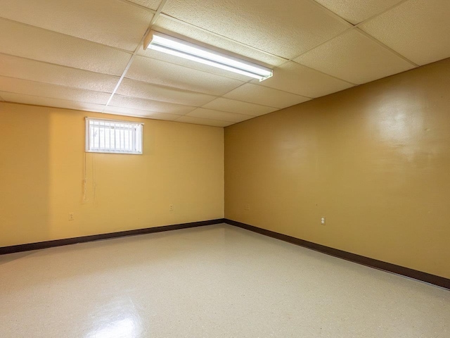 basement featuring a paneled ceiling