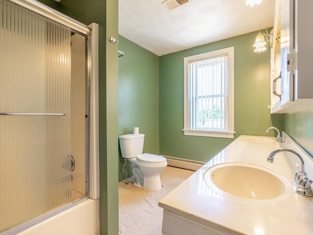 full bathroom featuring baseboard heating, bath / shower combo with glass door, vanity, a textured ceiling, and toilet