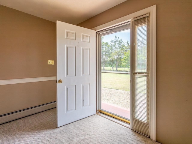 entryway with a baseboard radiator and light carpet