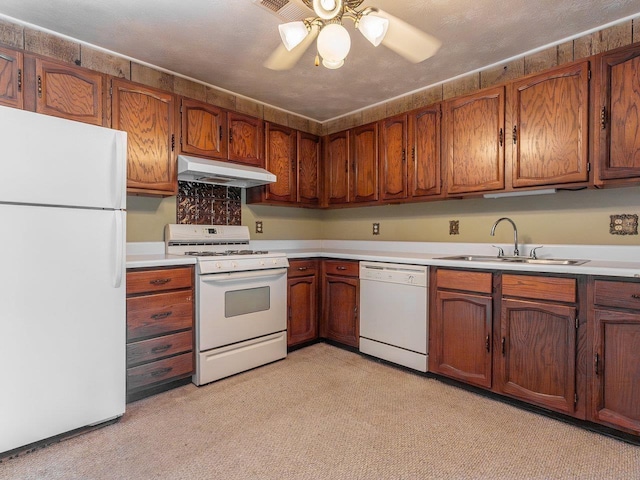 kitchen with sink, white appliances, a textured ceiling, and ceiling fan