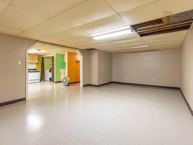 basement featuring washer / clothes dryer and a drop ceiling