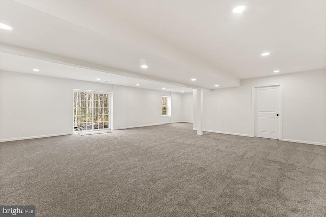 below grade area with carpet flooring, recessed lighting, and baseboards