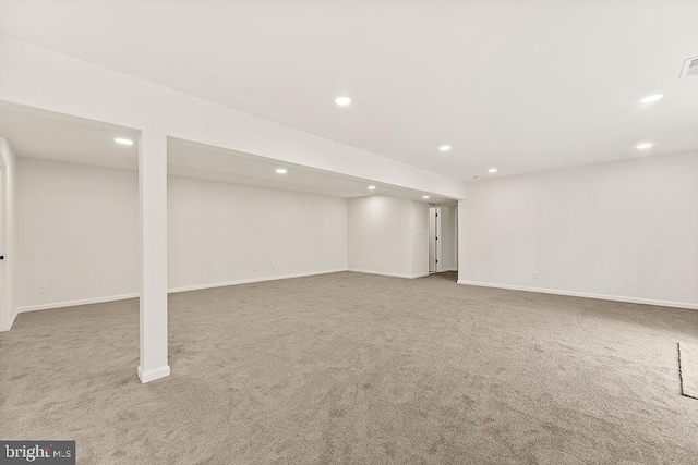 finished basement featuring recessed lighting, visible vents, and baseboards