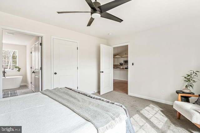 bedroom with light colored carpet, baseboards, and ceiling fan