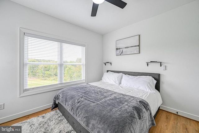 bedroom featuring ceiling fan and hardwood / wood-style floors