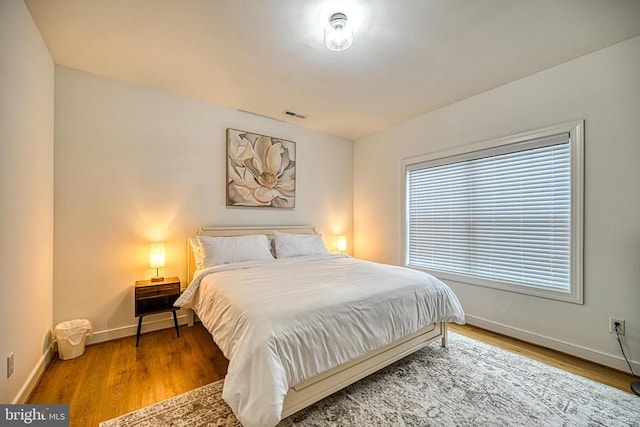 bedroom featuring wood-type flooring