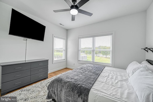 bedroom featuring light hardwood / wood-style flooring and ceiling fan