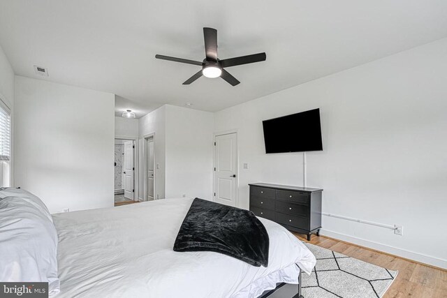 bedroom with ceiling fan and light wood-type flooring