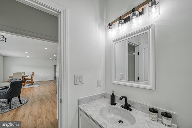 bathroom featuring hardwood / wood-style flooring and vanity