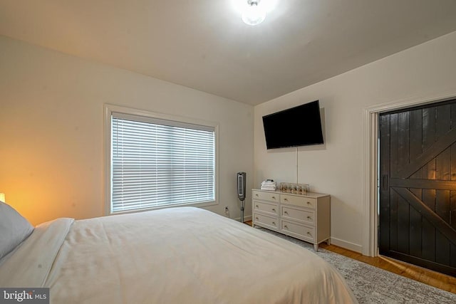 bedroom with wood-type flooring