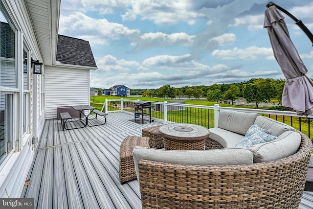 wooden deck with a fire pit