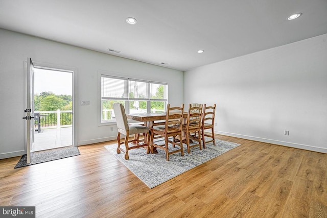 dining area with light hardwood / wood-style flooring