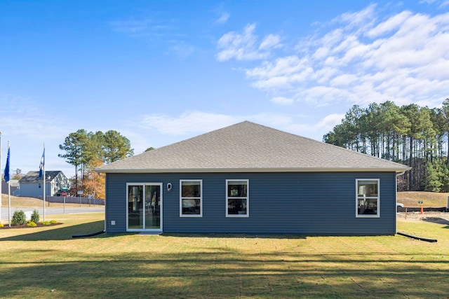 back of house with a yard