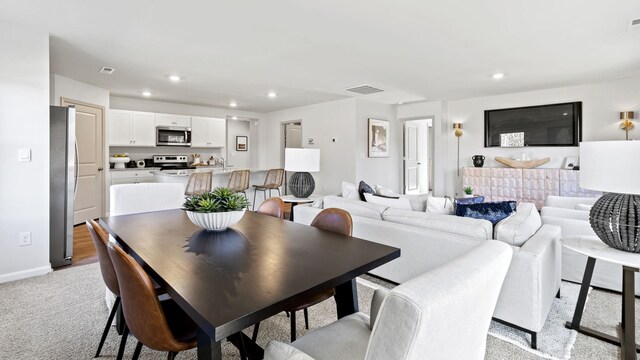 view of carpeted dining space