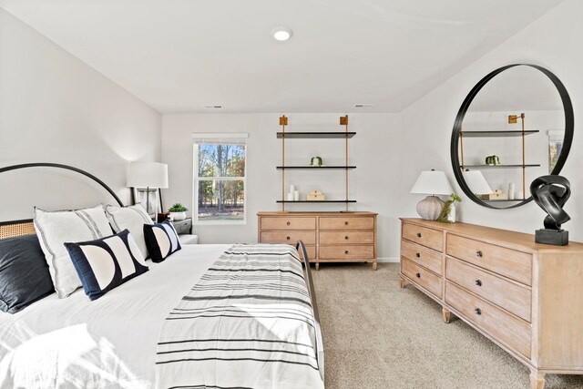 bedroom with light colored carpet