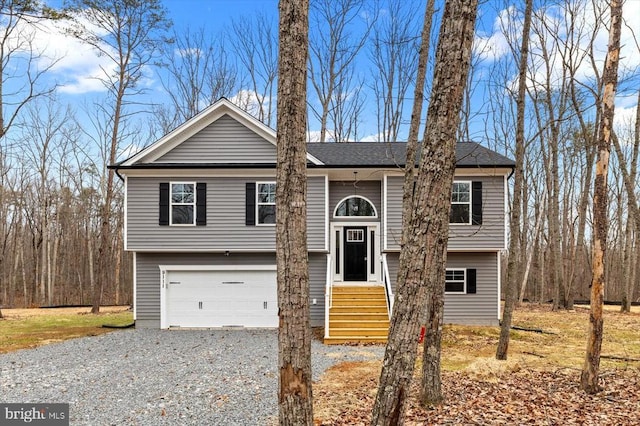 split foyer home featuring driveway and an attached garage