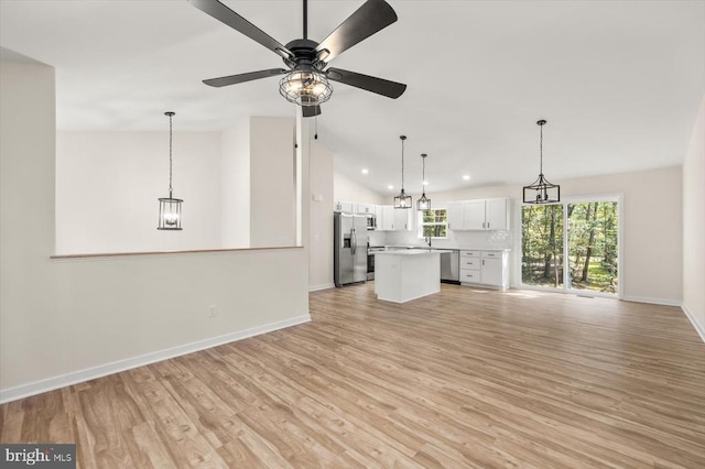 unfurnished living room featuring light wood finished floors, lofted ceiling, recessed lighting, ceiling fan, and baseboards