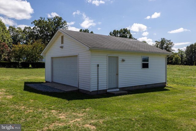 garage with a yard