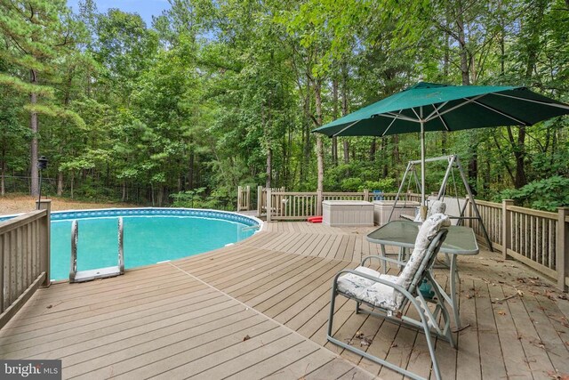 view of pool featuring a wooden deck