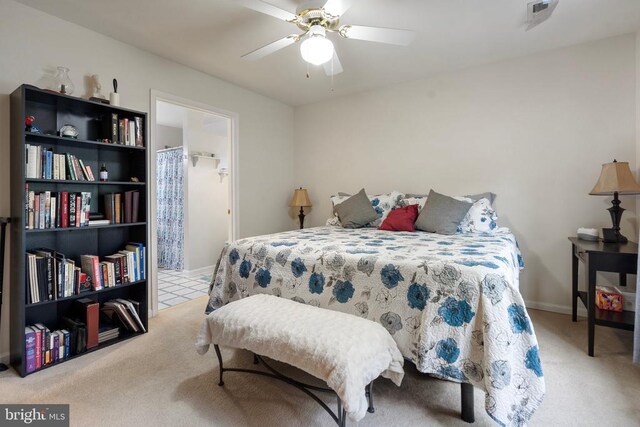 bedroom featuring ceiling fan and light carpet