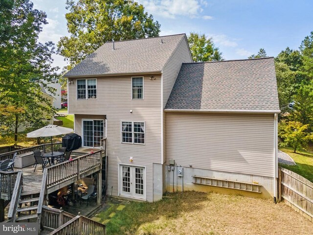 back of property featuring a deck