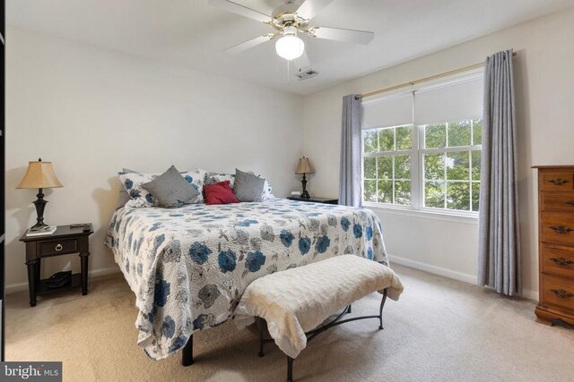 bedroom featuring ceiling fan and light colored carpet