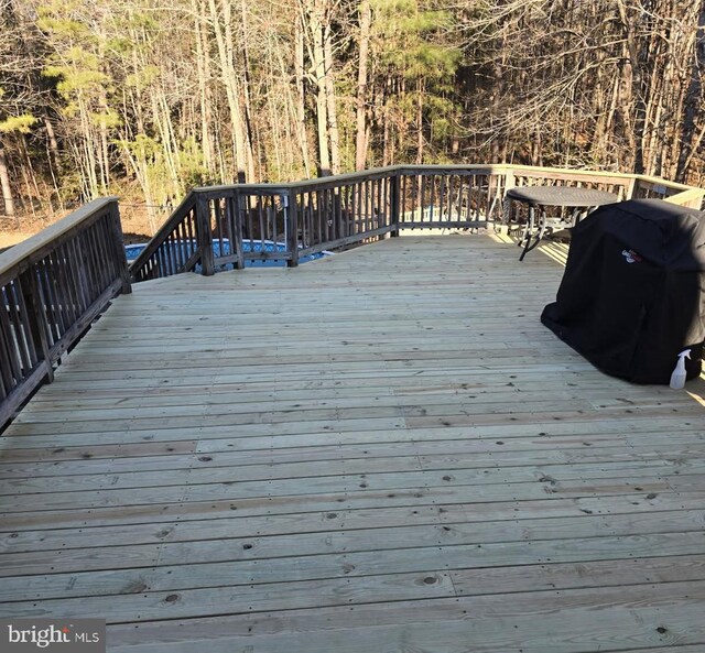 wooden deck featuring grilling area