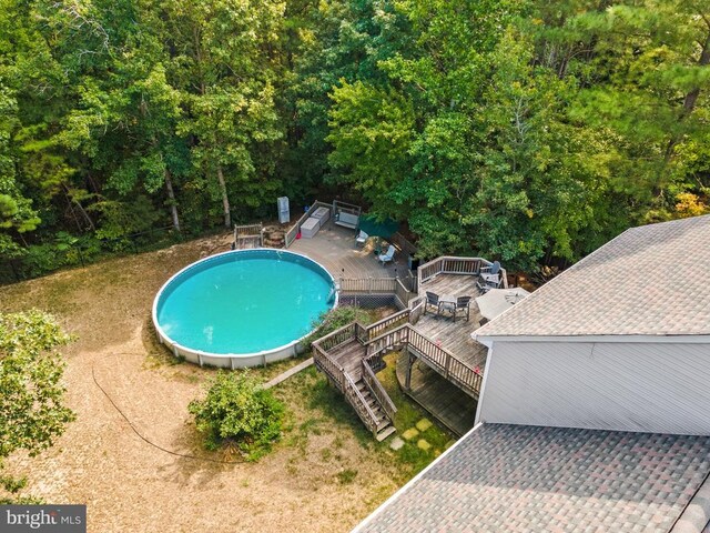 view of swimming pool featuring a wooden deck