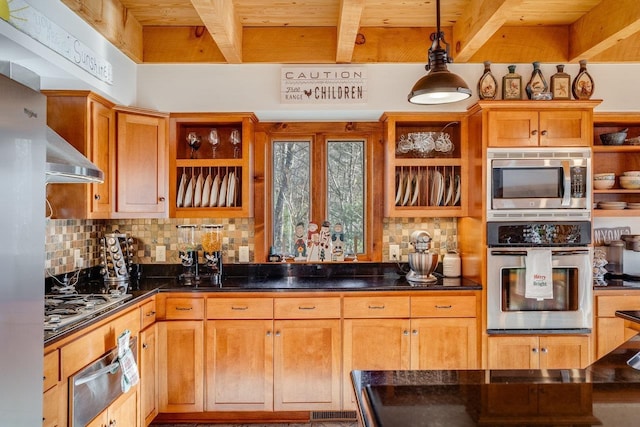 kitchen featuring hanging light fixtures, range hood, stainless steel appliances, decorative backsplash, and beamed ceiling