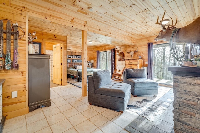 living room featuring light tile patterned floors, wooden ceiling, and wood walls