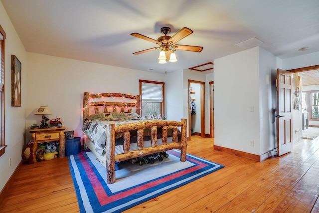 bedroom with ceiling fan and light hardwood / wood-style floors