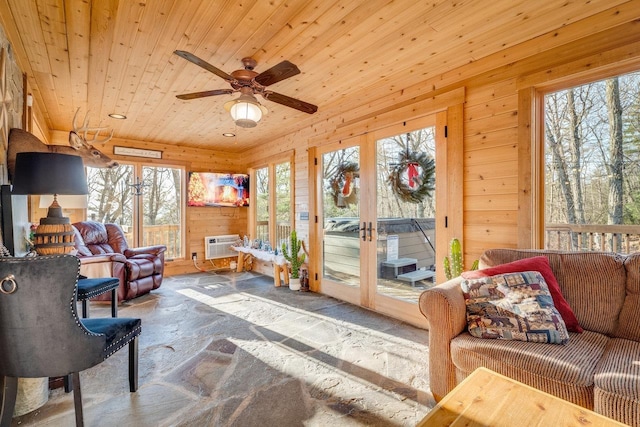 sunroom / solarium featuring french doors, ceiling fan, a wall mounted air conditioner, and wooden ceiling