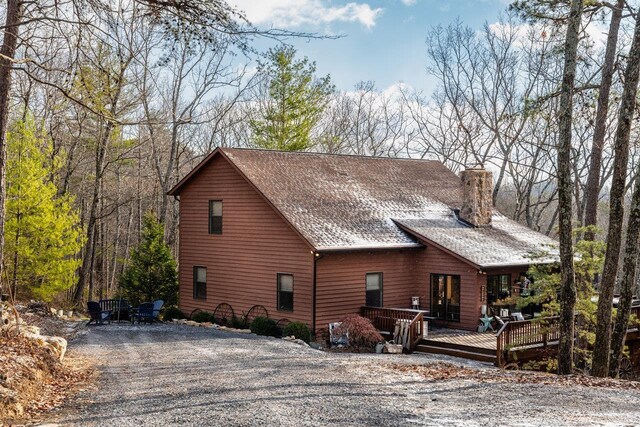 view of home's exterior featuring a deck