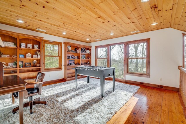 playroom with wooden ceiling, vaulted ceiling, light hardwood / wood-style flooring, and a wealth of natural light