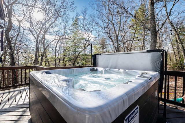 deck featuring a hot tub