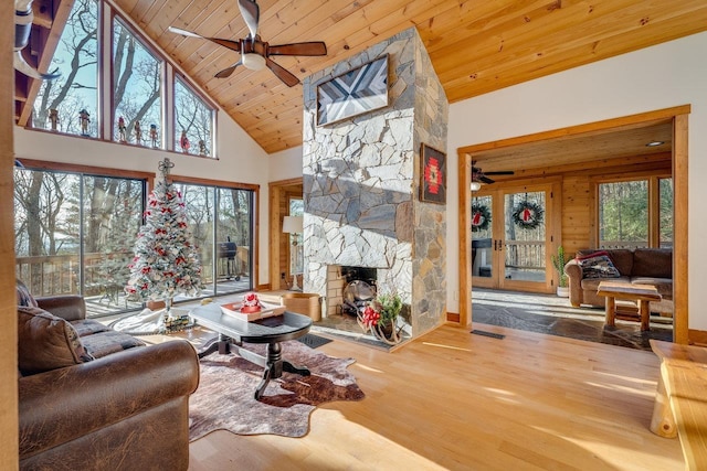 living room featuring hardwood / wood-style flooring, a wealth of natural light, and wooden ceiling