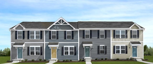 view of front of home with entry steps and a front yard