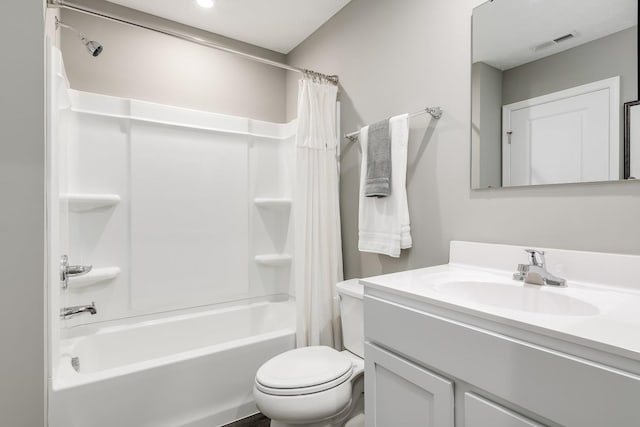 full bathroom featuring shower / bath combination with curtain, toilet, vanity, and visible vents