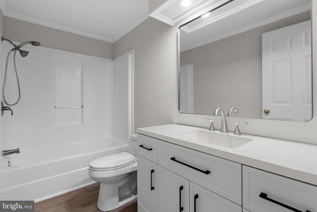 full bath featuring crown molding, toilet, shower / bath combination, wood finished floors, and vanity