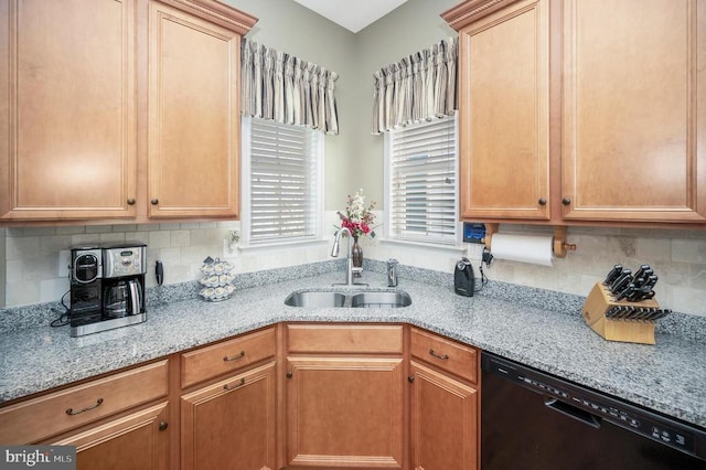 kitchen with a sink, decorative backsplash, light stone counters, and dishwasher