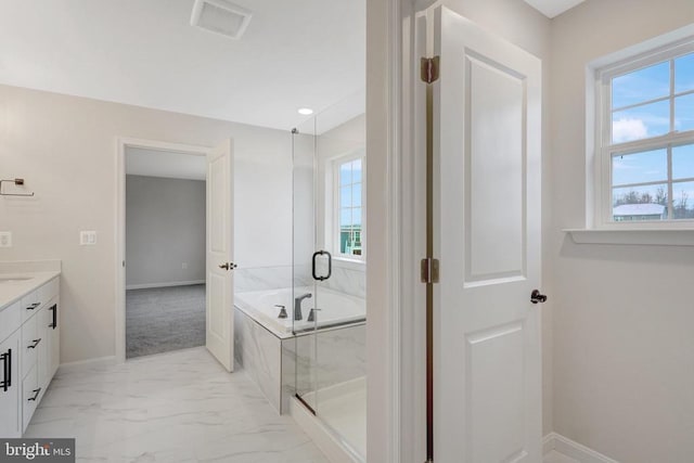 bathroom with visible vents, vanity, baseboards, marble finish floor, and a bath