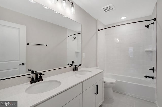 full bathroom with visible vents, shower / washtub combination, a sink, and tile patterned floors