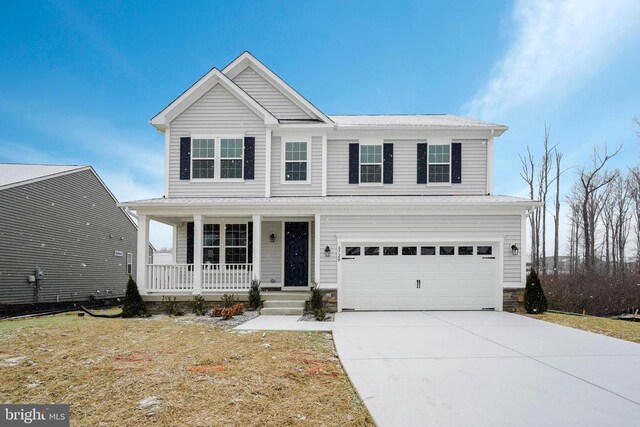 craftsman house with a garage, a front lawn, and a porch