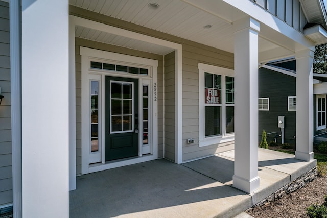 property entrance with covered porch