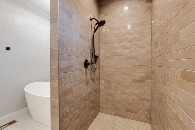 bathroom with separate shower and tub