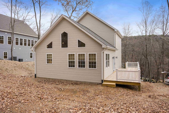 back of property featuring a wooden deck