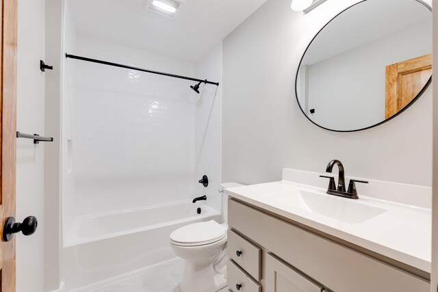 full bathroom with vanity, tile patterned floors, toilet, and washtub / shower combination