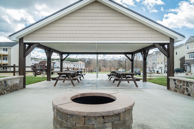 view of patio / terrace with a gazebo and a fire pit