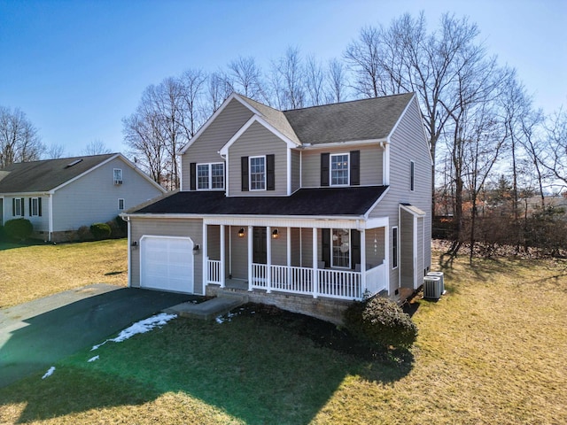 view of front of house featuring aphalt driveway, roof with shingles, covered porch, a front yard, and central AC