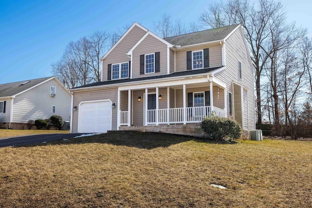 view of front facade featuring aphalt driveway, central AC unit, a porch, and a front yard